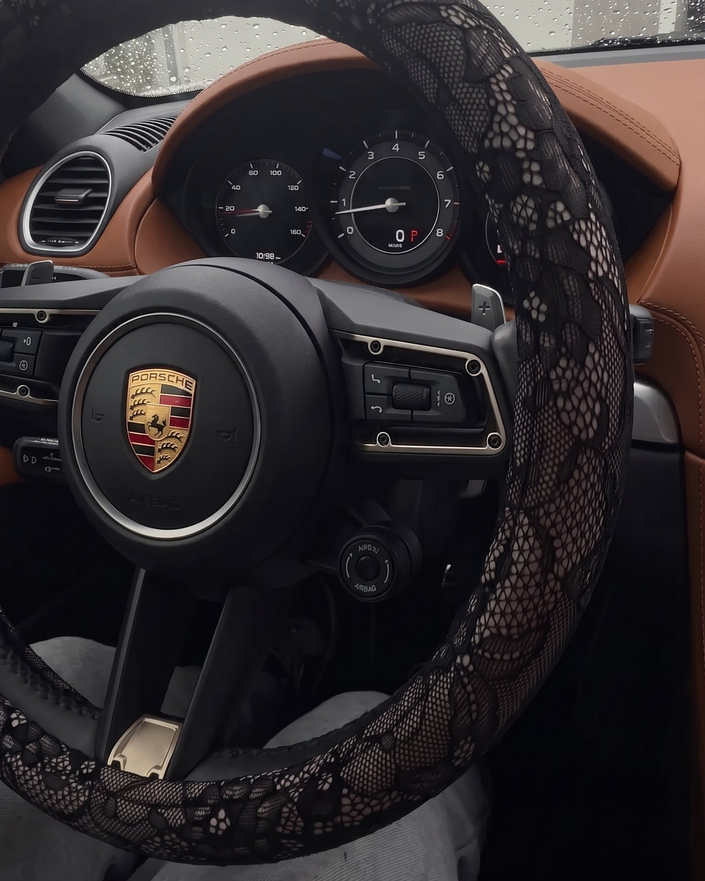 The lace wheel cover in a cabin with brown leather
