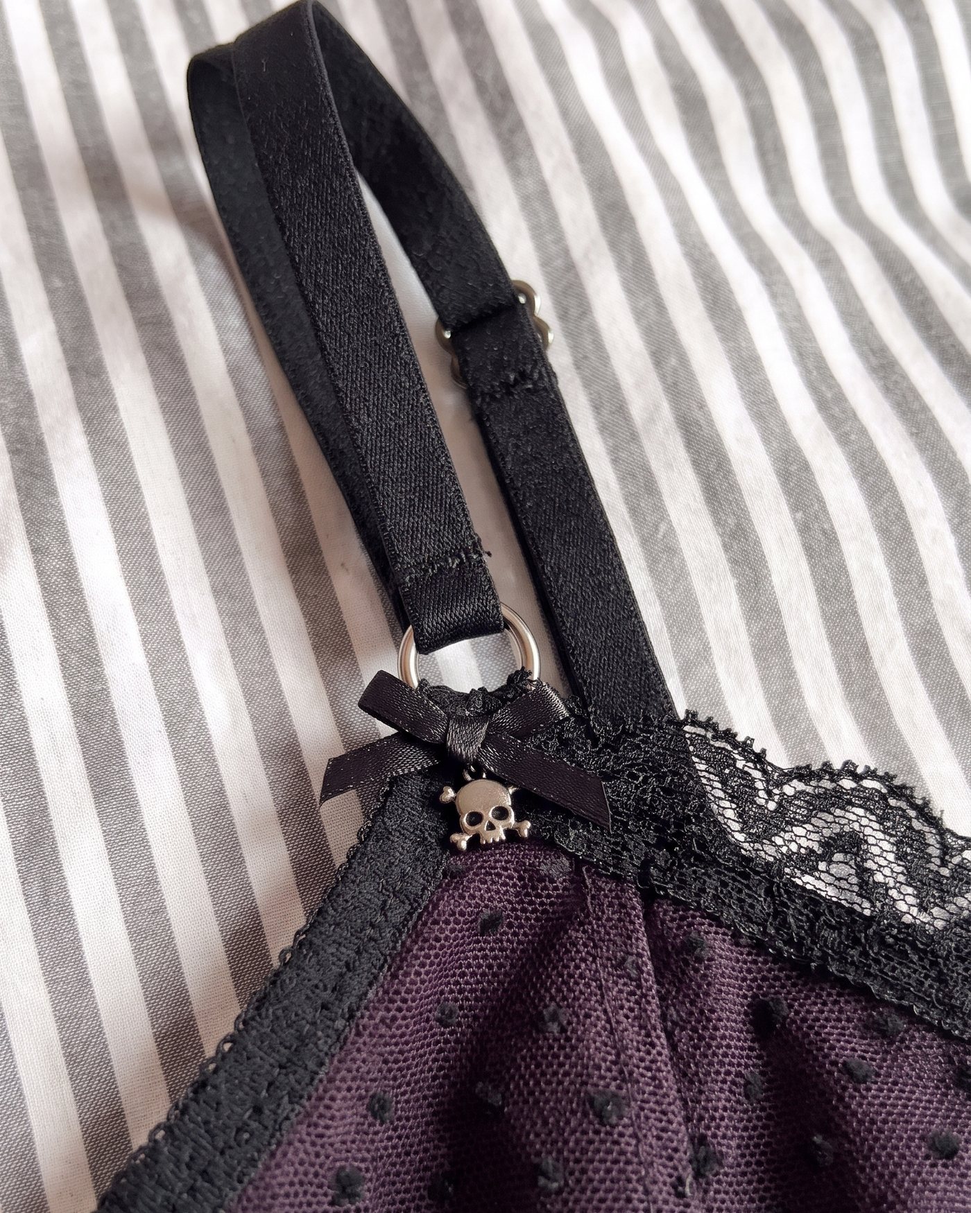 Close up of the lace trim, the O ring and the adjustable strap